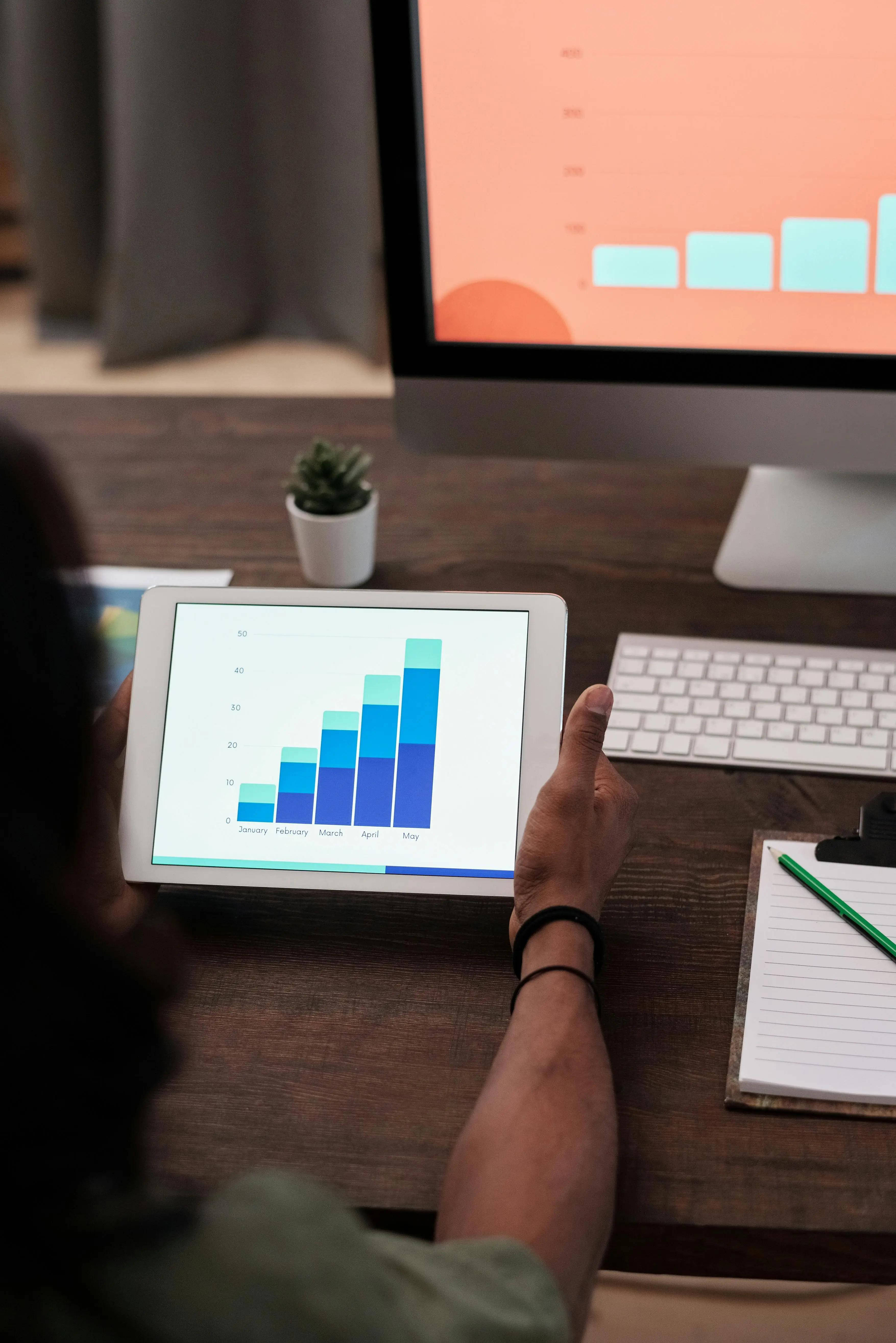 A TrustDesk team member reviewing growth analytics at their desk